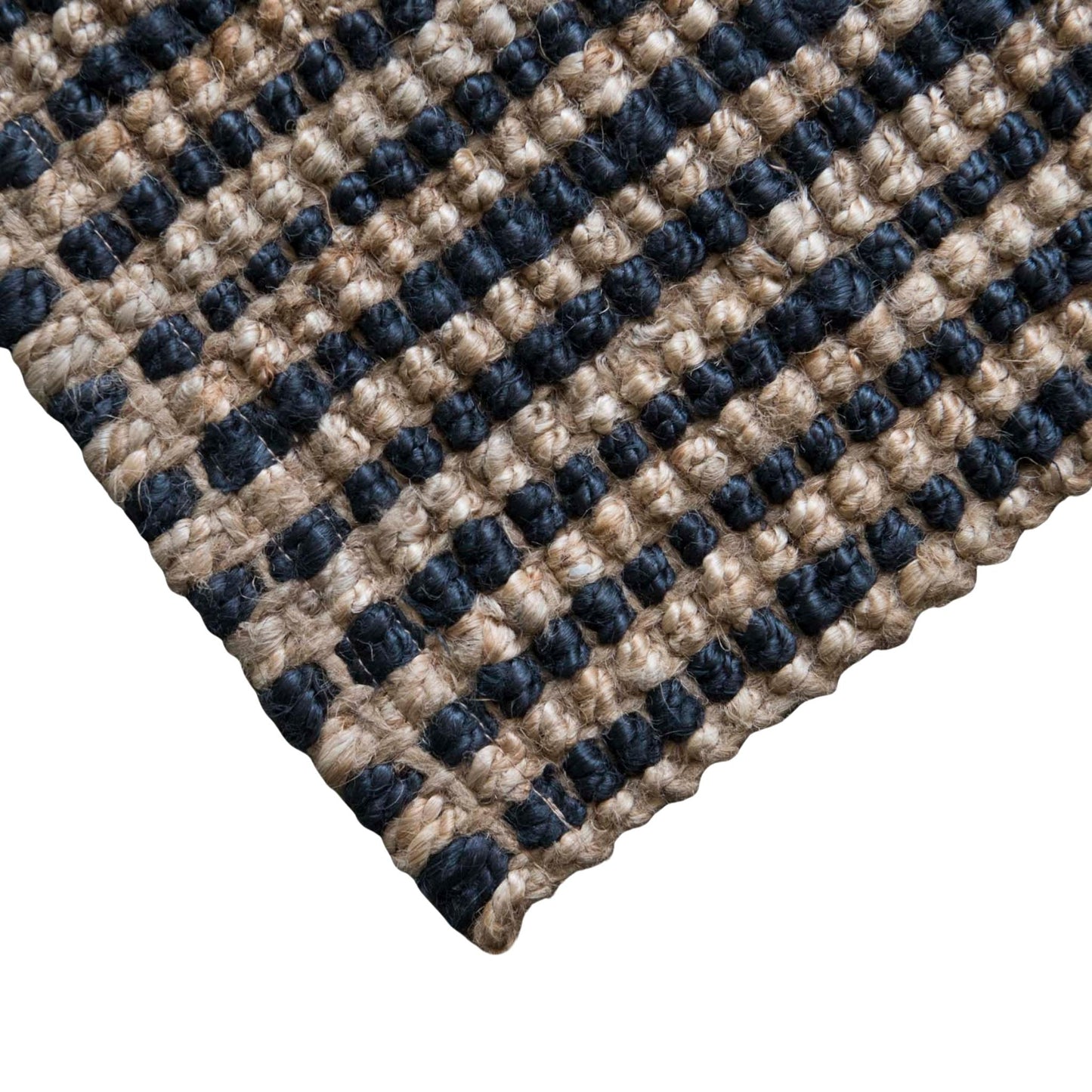 Close-up of the woven texture and graphite stripe on the Baxter jute rug with a white background.