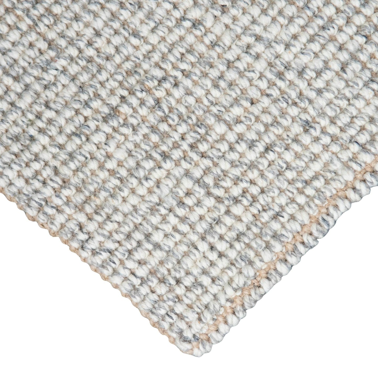 Close-up of Carter handcrafted grey white heathered wool and jute bouclé rug.