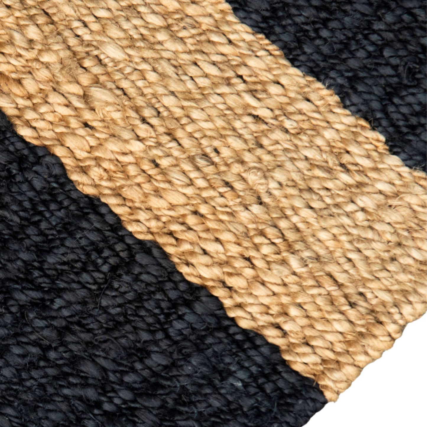 Close-up of the flat weave texture and graphite stripe on the Irving jute small rug.