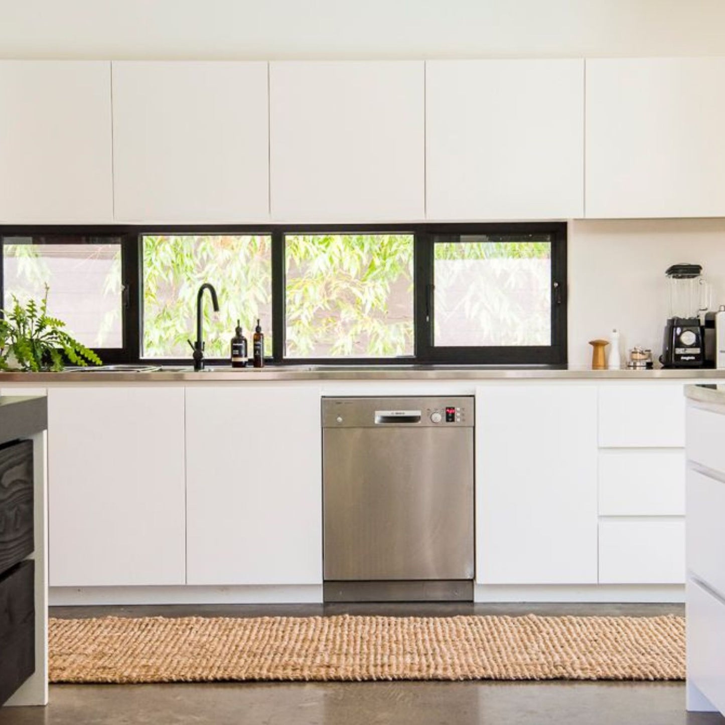 Handcrafted natural bouclé jute runner rug in a modern sunlit kitchen.
