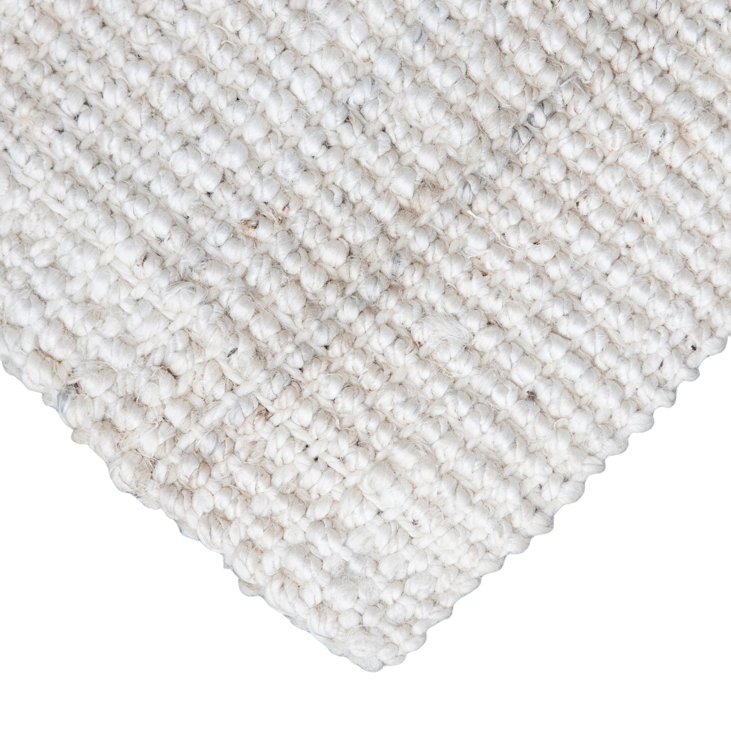 Close-up of Vincent, whitewashed, chunky jute bouclé rug on white background.