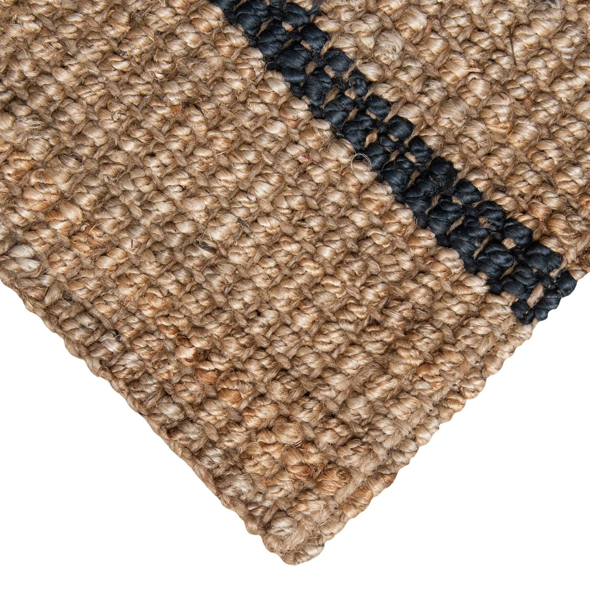 Handcrafted bailey stripe chunky jute bouclé runner close up with white background in a natural color with graphite stripe.