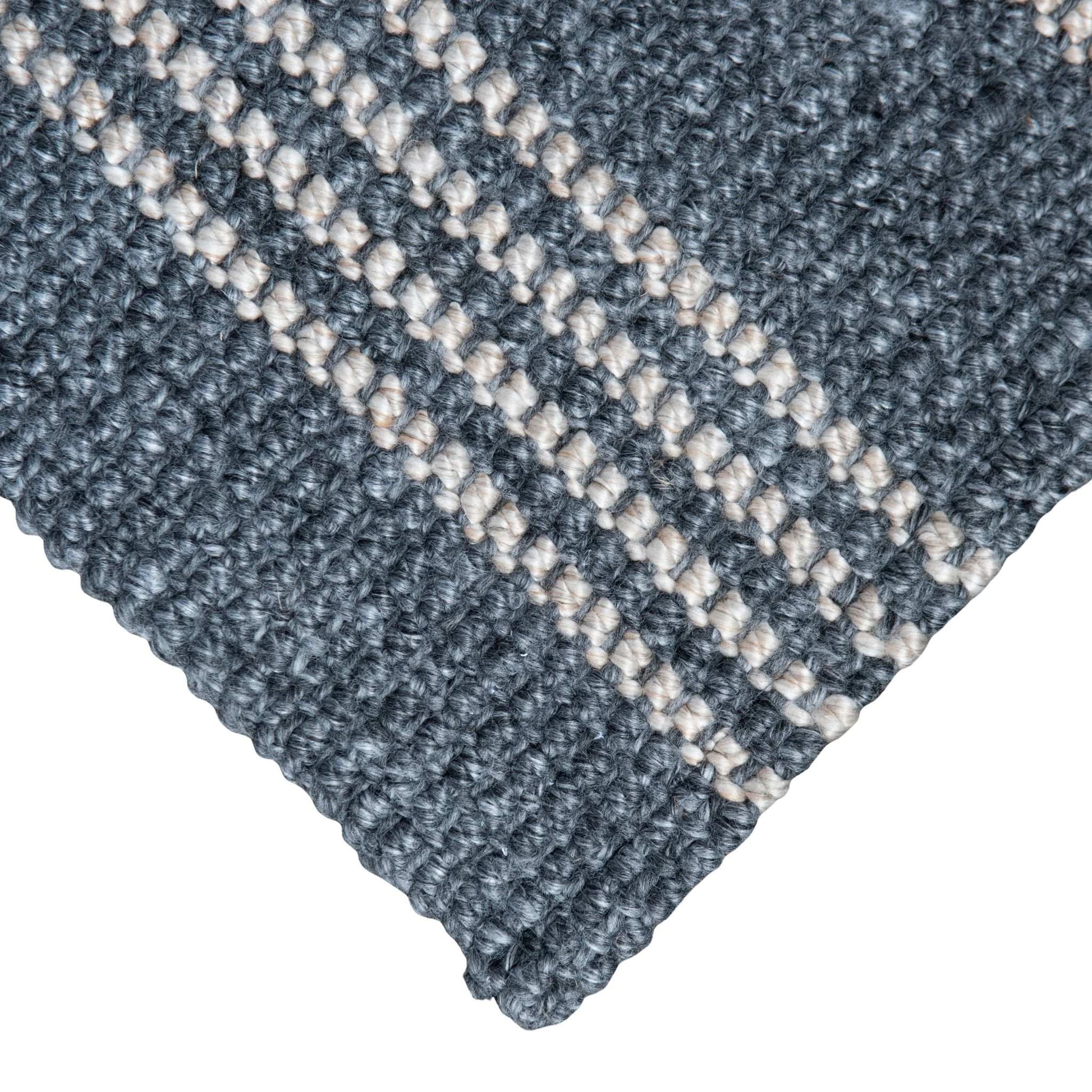 Close-up of Macintosh flatweave slate grey rug with natural stripes, made from 100% recycled PET with white background.