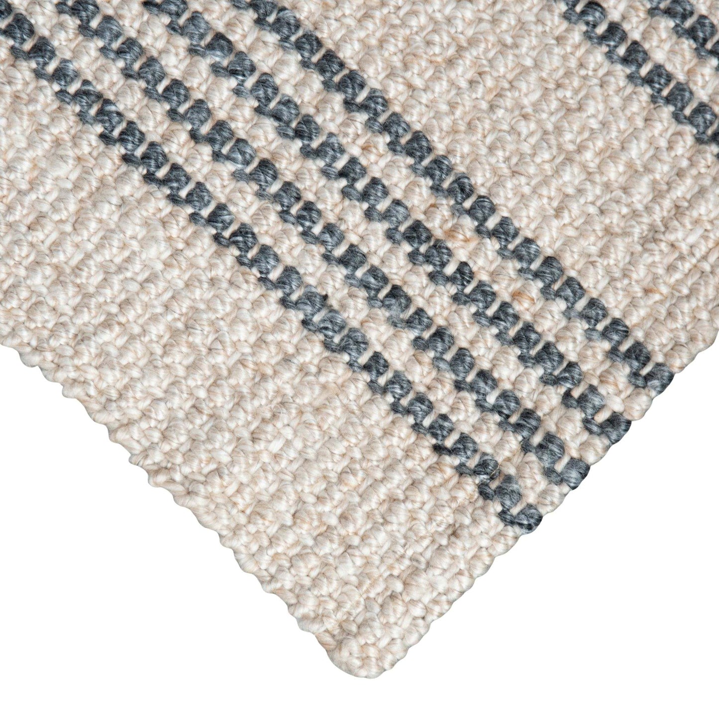 Close-up of Macintosh flatweave rug, with natural and slate grey stripes made from 100% recycled PET with white background.