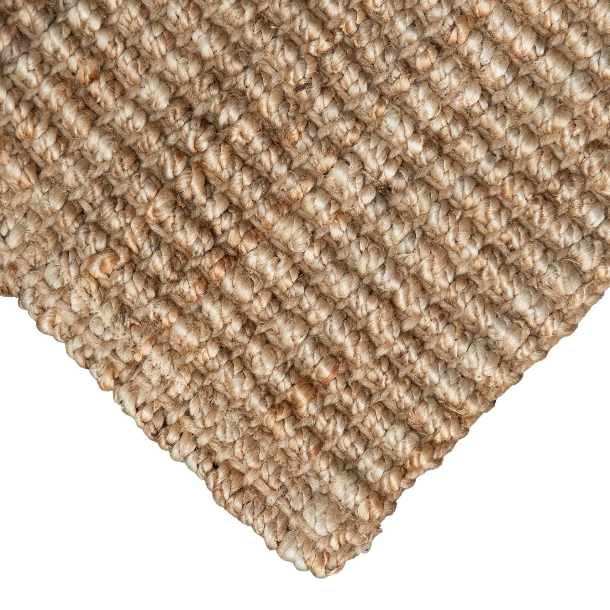 Close-up of Handcrafted natural, bouclé weave jute texture with white background.