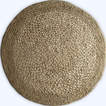 Close-up of Westmore hand-braided two toned natural, jute round rug with a border on a white background.