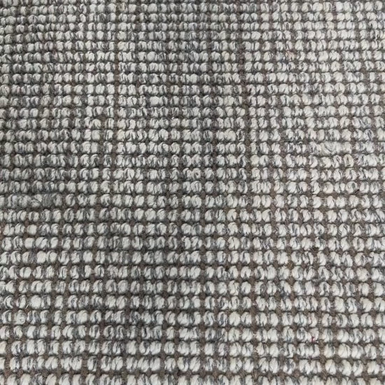 Close-up video of carter handcrafted heathered wool and jute bouclé rug