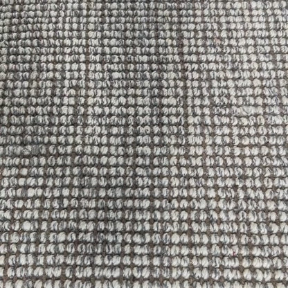 Close-up video of carter handcrafted heathered wool and jute bouclé rug