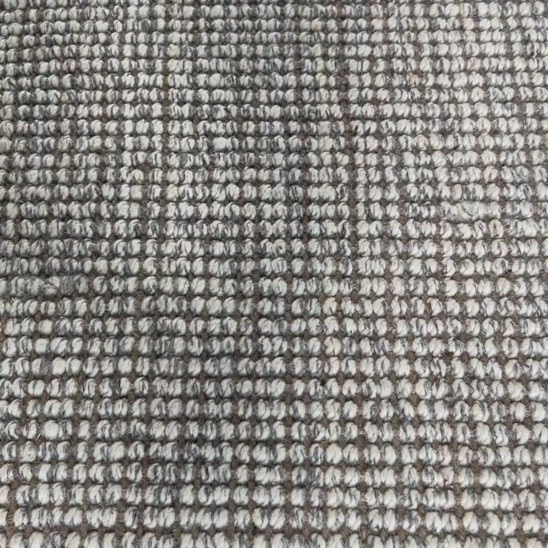 Close-up video of carter handcrafted heathered wool and jute bouclé rug